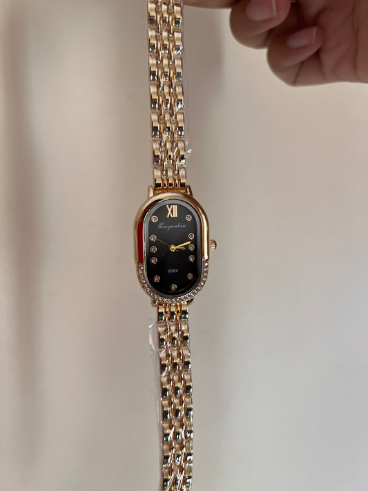 Oval black dial watch