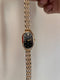 Oval black dial watch