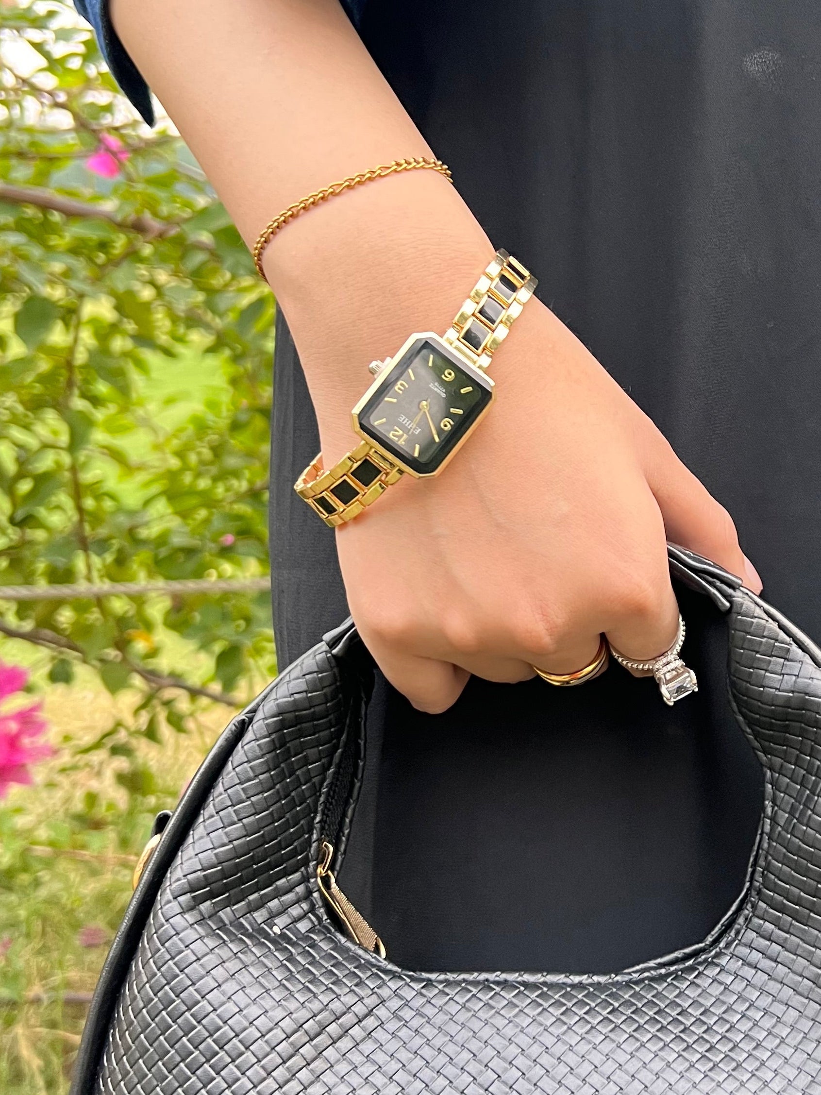 Rectangle shaped black blocks golden watch