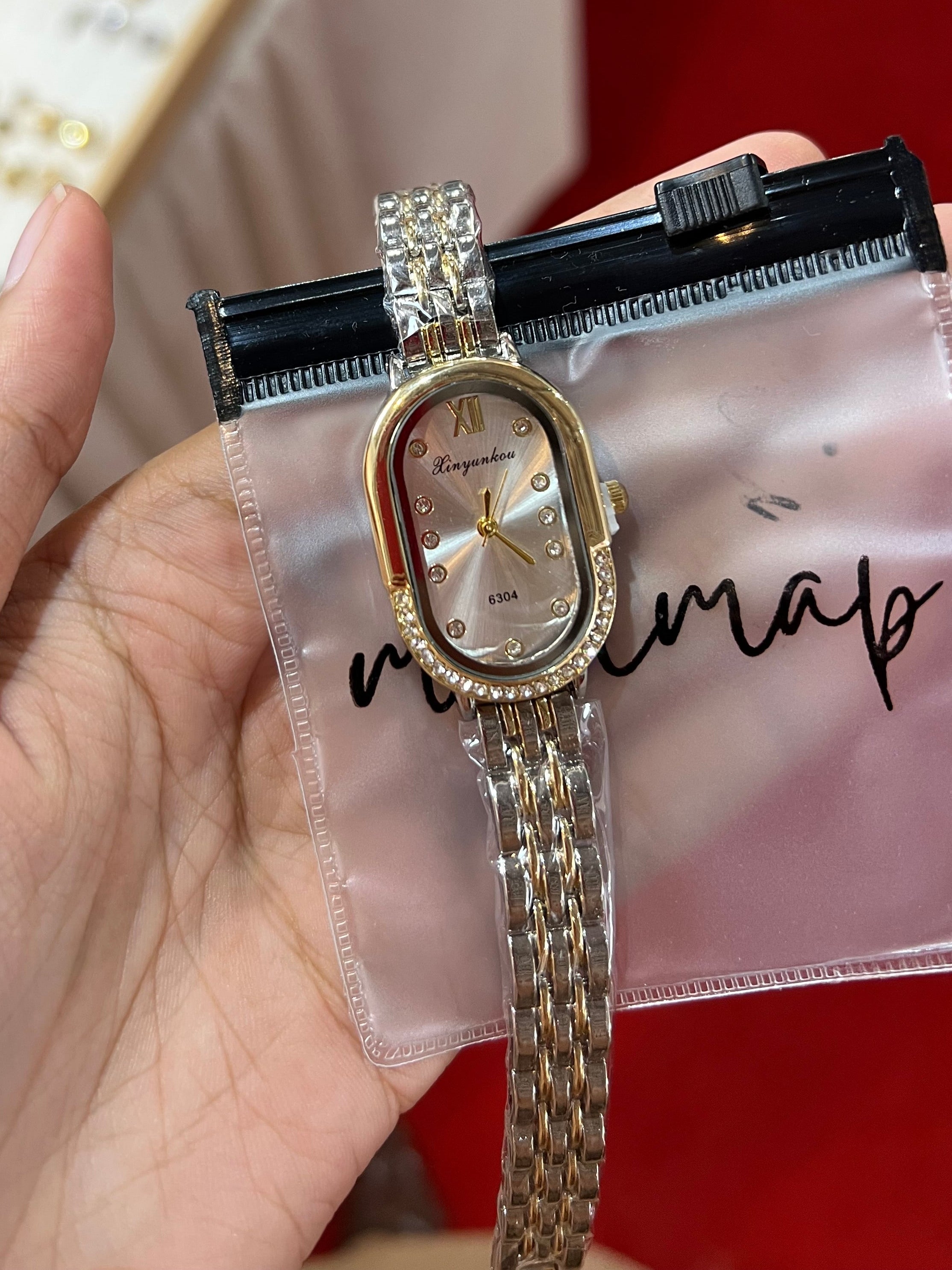 Oval dial two-tone watch