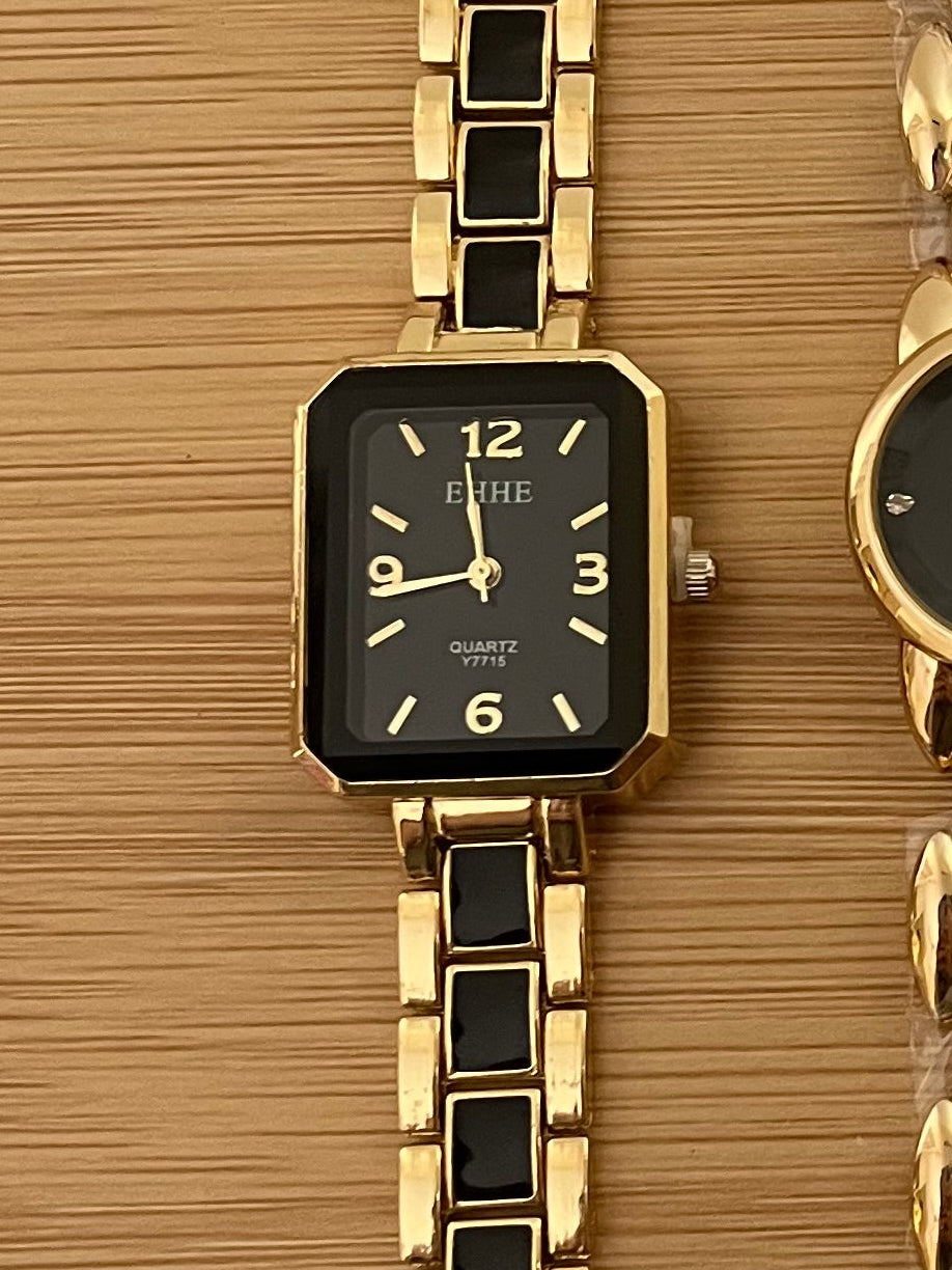 Rectangle shaped black blocks golden watch